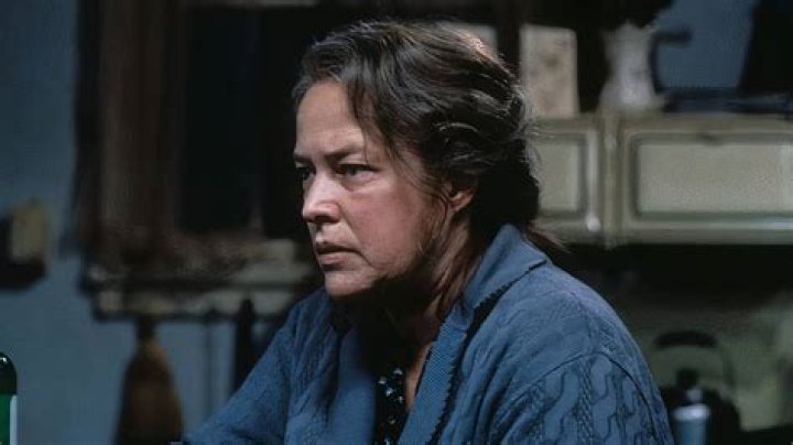 Dolores sitting at the table in Encanto.