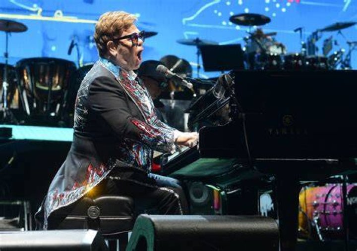 Elton John performs in the opening ceremony for Saks Fifth Avenue’s Holiday Windows and Light show on November 22, 2022, in New York City. | Source: Getty Images