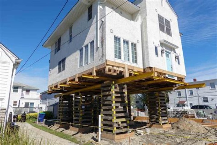Luisa lifting a house on Encanto
